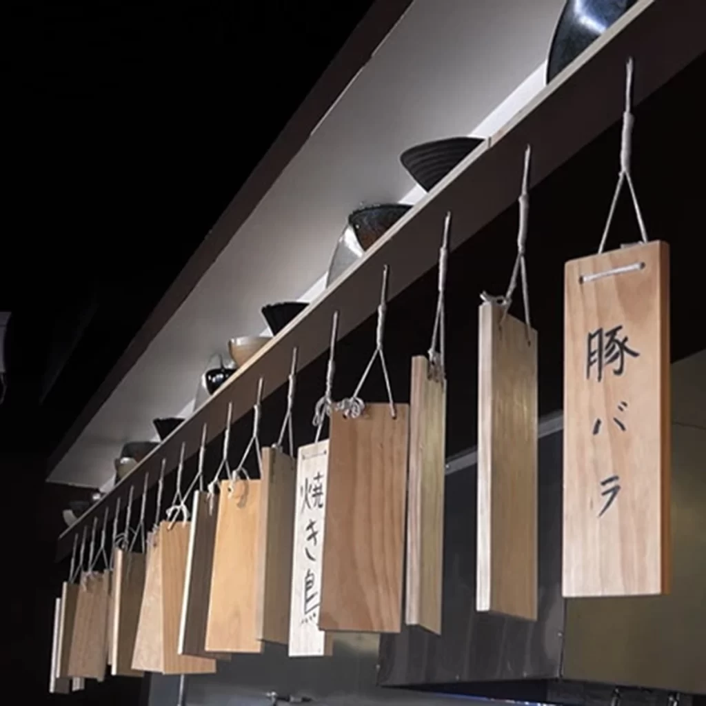 Wooden hanging menu tags with Japanese words at Ichiddo Ramen, Ramen Restaurant in Poughkeepsie